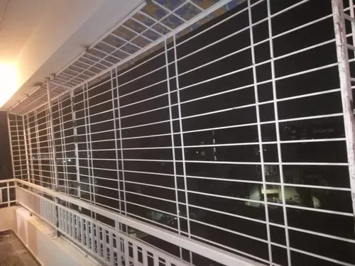 A balcony closed in by a welded MS grill with heavy horizontal bars